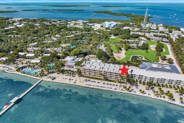 bird's eye view with a water view and a beach view