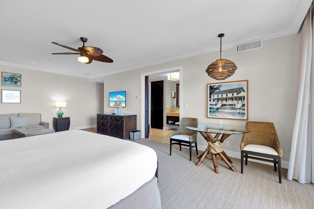 carpeted bedroom with crown molding, ceiling fan, and ensuite bath