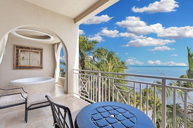 balcony featuring a water view