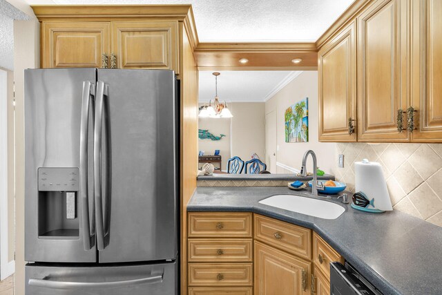 kitchen featuring dishwasher, sink, backsplash, ornamental molding, and stainless steel refrigerator with ice dispenser