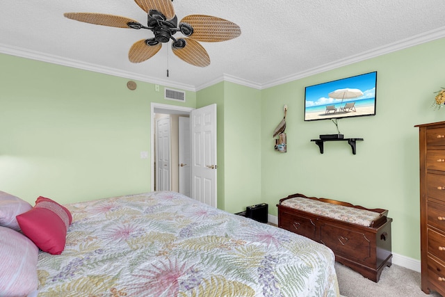 bedroom featuring ornamental molding, light carpet, ceiling fan, and a textured ceiling