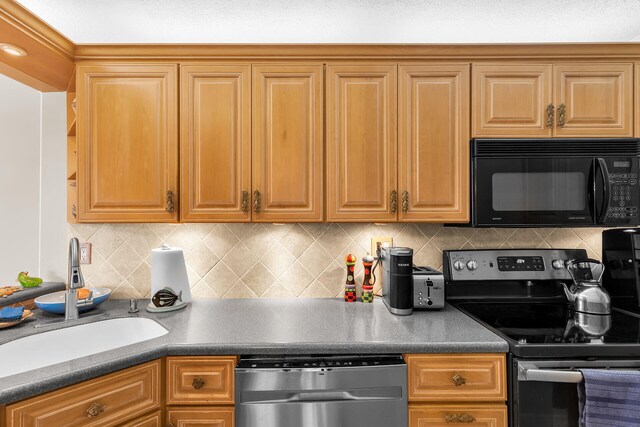 kitchen featuring tasteful backsplash, stainless steel appliances, and sink