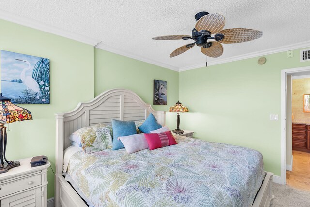 carpeted bedroom with crown molding and a textured ceiling