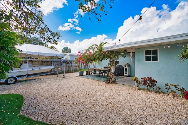 view of yard featuring a patio and fence