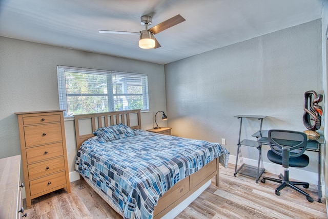 bedroom featuring light hardwood / wood-style flooring and ceiling fan