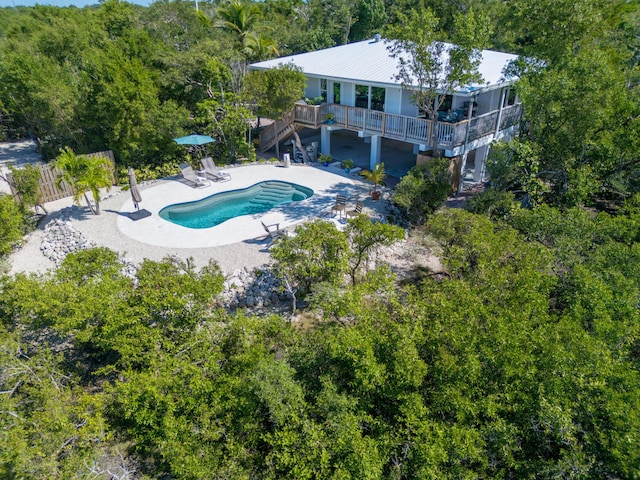 view of pool featuring a deck and a patio