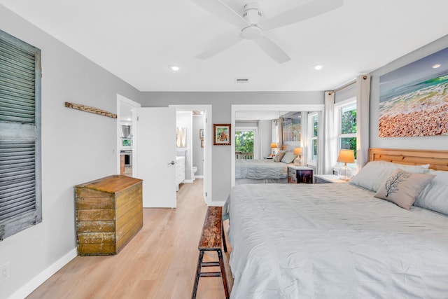 bedroom with ceiling fan and light hardwood / wood-style flooring