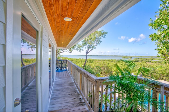 balcony featuring a water view