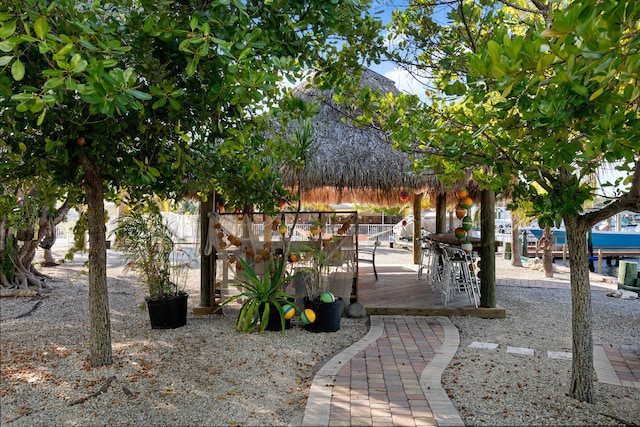 view of community featuring a wooden deck and a gazebo