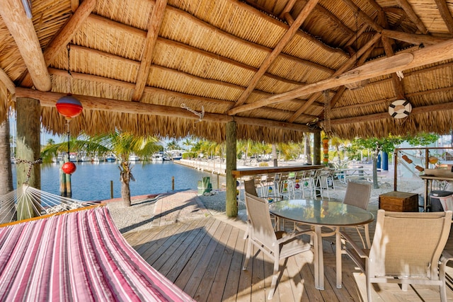 dock area with a gazebo and a water view