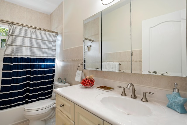 full bathroom featuring vanity, tile walls, shower / bath combination with curtain, and toilet