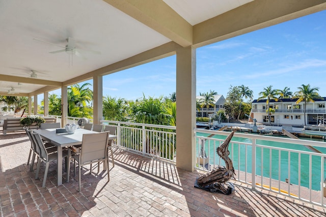 view of patio / terrace with outdoor dining space and a ceiling fan