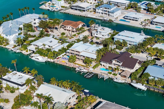 drone / aerial view featuring a residential view and a water view