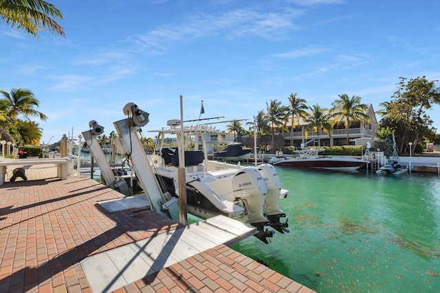 view of dock featuring a water view and boat lift