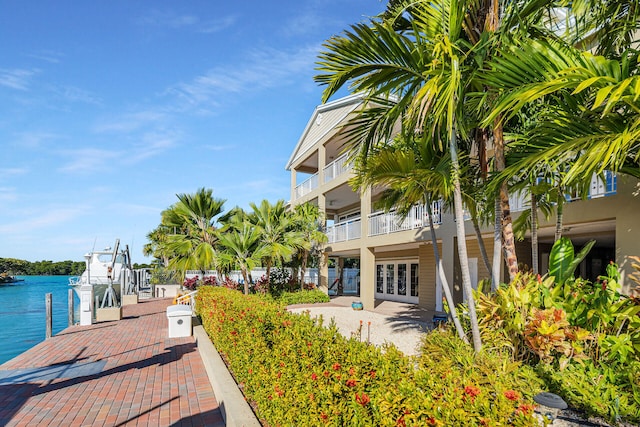 exterior space with a patio area and a water view