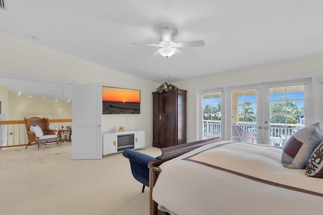 bedroom with access to exterior, french doors, light colored carpet, ceiling fan, and vaulted ceiling