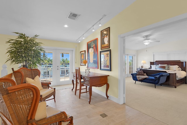 interior space featuring visible vents, french doors, rail lighting, baseboards, and ceiling fan