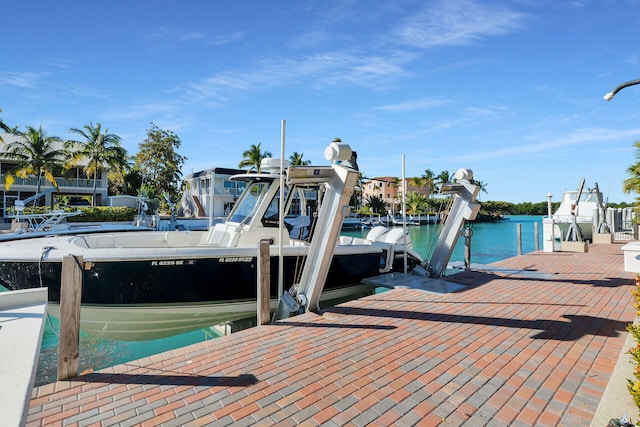 view of dock featuring a water view and boat lift