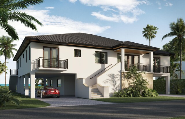 view of front of home with a balcony and a carport