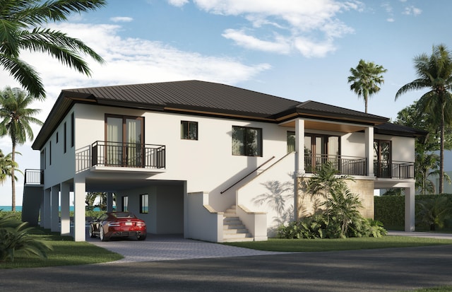 view of front of property featuring a carport and a balcony