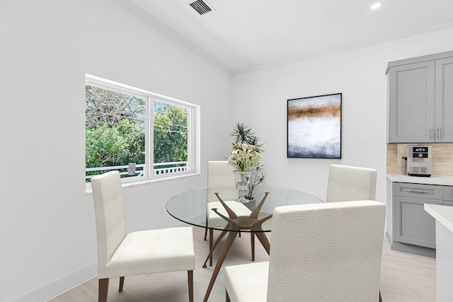 14 Tarpon Ave, Key Largo, FL 33037 - dining area with light wood-style floors, recessed lighting, and crown molding