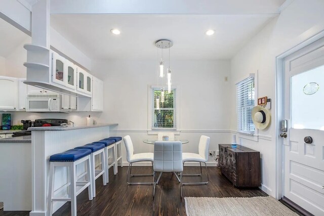 817 Terry Ln, Key West, FL 33040 - dining space with recessed lighting, dark wood-style flooring, and plenty of natural light