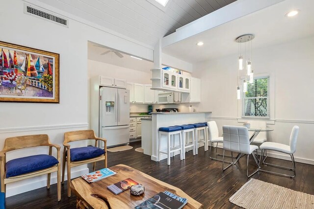 817 Terry Ln, Key West, FL 33040 - living area featuring vaulted ceiling, visible vents, and dark wood finished floors