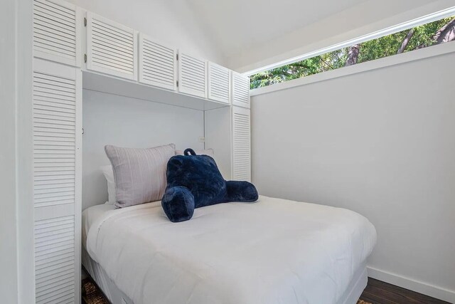 817 Terry Ln, Key West, FL 33040 - bedroom featuring dark wood-style floors and baseboards