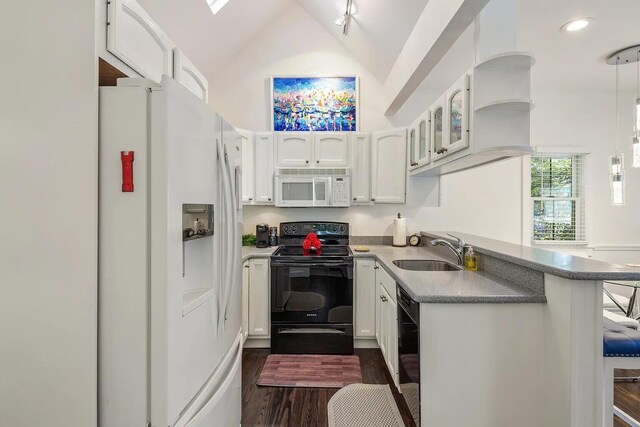 817 Terry Ln, Key West, FL 33040 - kitchen featuring glass insert cabinets, a sink, white cabinets, black appliances, and decorative light fixtures
