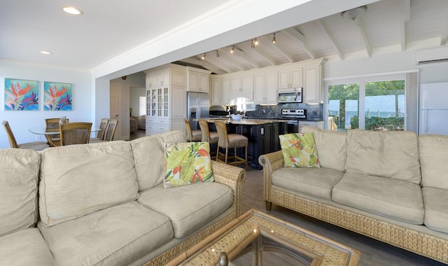 living room with ornamental molding, beam ceiling, and a wall mounted AC