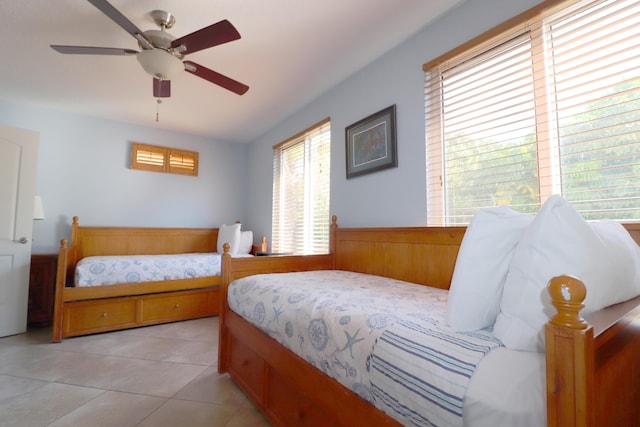 bedroom with light tile patterned flooring and a ceiling fan