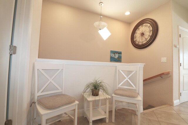 sitting room with tile patterned flooring, an upstairs landing, and recessed lighting