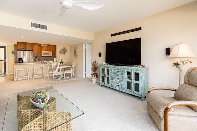 104500 Overseas Hwy Unit B202, Key Largo, FL 33037 - living room with a ceiling fan and light colored carpet