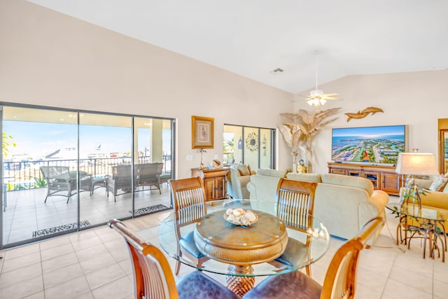 564 Sombrero Beach Rd, Marathon, FL 33050 - dining room with light tile patterned flooring, ceiling fan, and vaulted ceiling