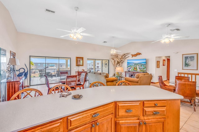 564 Sombrero Beach Rd, Marathon, FL 33050 - kitchen featuring ceiling fan, light tile patterned floors, lofted ceiling, and light countertops