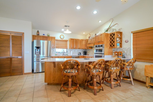 564 Sombrero Beach Rd, Marathon, FL 33050 - kitchen featuring stainless steel appliances, open shelves, tasteful backsplash, light countertops, and a sink