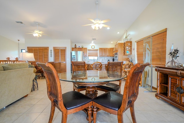 564 Sombrero Beach Rd, Marathon, FL 33050 - dining room with ceiling fan, light tile patterned flooring, and vaulted ceiling