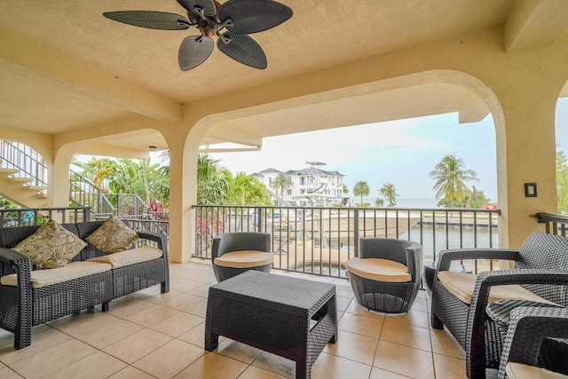 564 Sombrero Beach Rd, Marathon, FL 33050 - view of patio with stairway, a water view, an outdoor hangout area, a ceiling fan, and a balcony