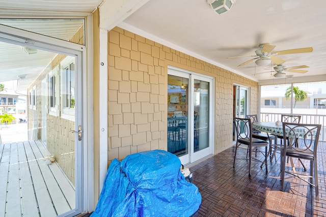 exterior space featuring beam ceiling and ceiling fan