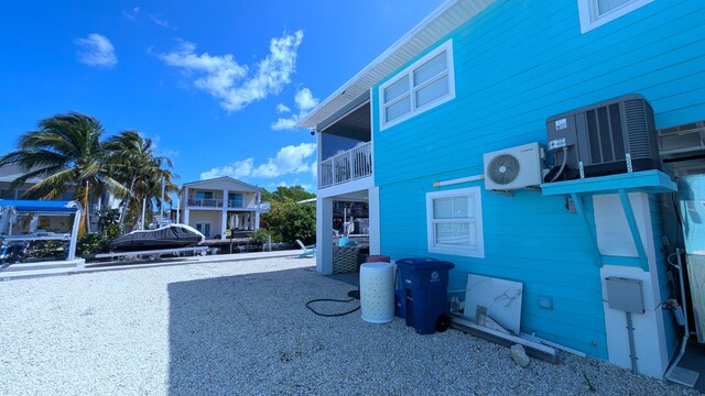 22961 John Avery Ln, Cudjoe, FL 33042 - view of home's exterior with a cooling unit and central air condition unit