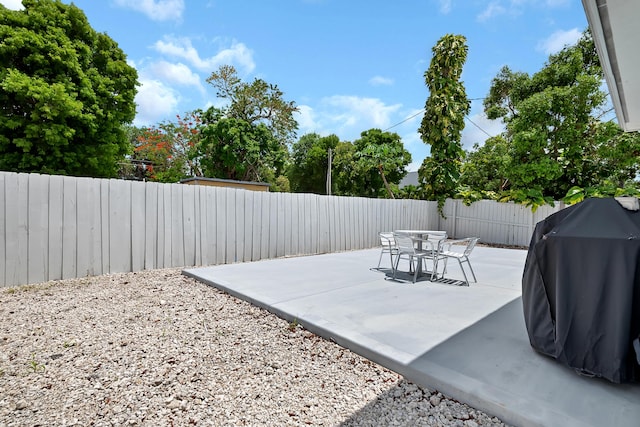 939 Plantation Rd, Key Largo, FL 33037 - fenced backyard featuring a grill and a patio