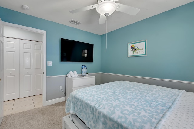 939 Plantation Rd, Key Largo, FL 33037 - bedroom featuring light carpet, light tile patterned flooring, a ceiling fan, and a closet