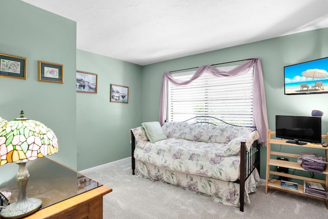 bedroom with light carpet