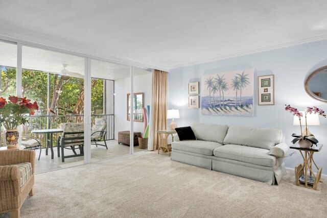 living room featuring a wall of windows, ornamental molding, and light colored carpet