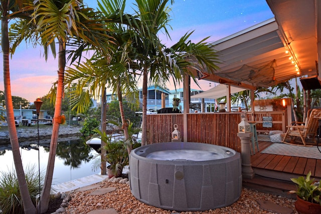 exterior space featuring a dock and a hot tub