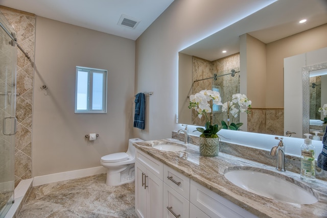 bathroom with vanity, toilet, and walk in shower