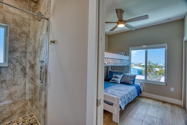 bedroom with ceiling fan and wood-type flooring