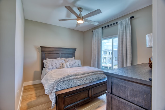 bedroom featuring ceiling fan and light wood-type flooring