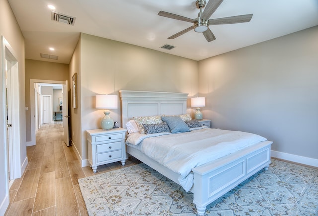 bedroom with ceiling fan and light wood-type flooring