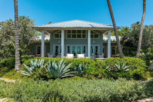 rear view of property featuring a patio area